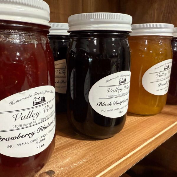 A variety of Valley View jams and jellies on a shelf.