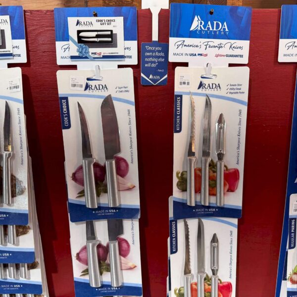 A variety of Rada Cutlery on a sales wall.