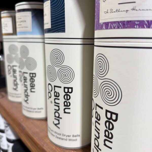 A variety of Beau Laundry Co. Container on a shelf.